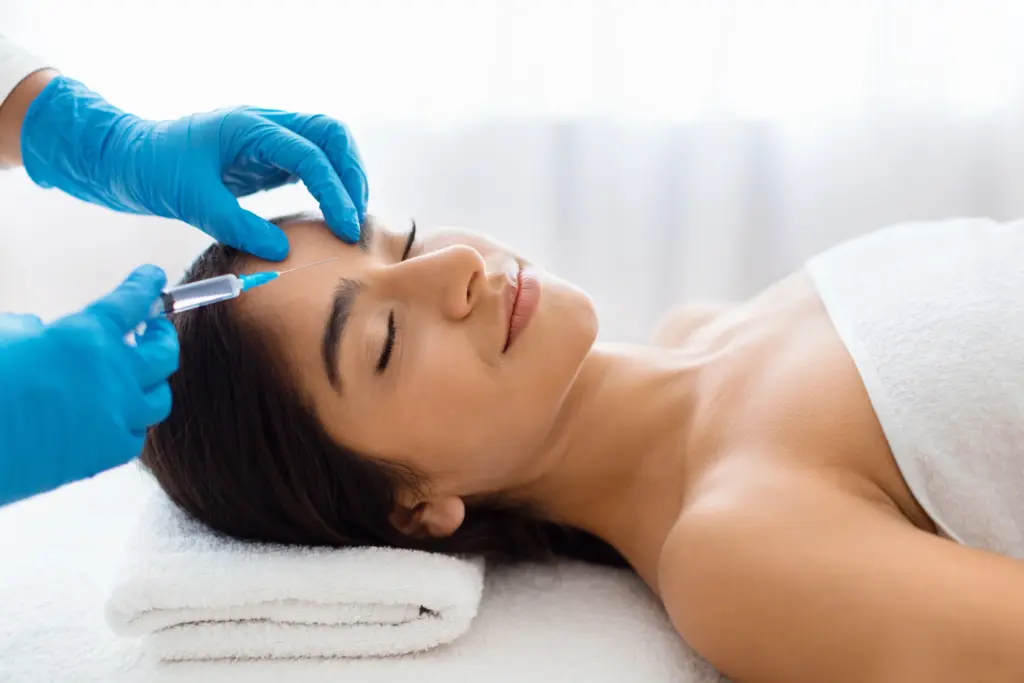 How Many Treatments Are Needed For Secret RF Microneedling? 2 Patient receiving Skin tightening treatment in Kay, TX for smoother, firmer skin.