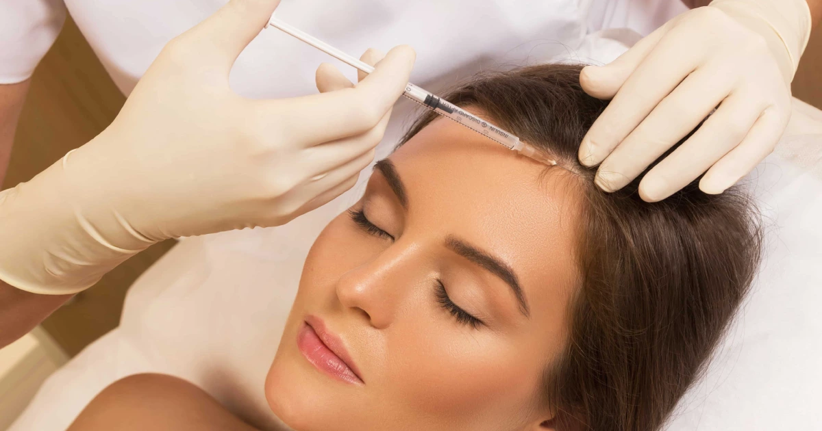Woman receiving hair restoration treatment in Katy, TX